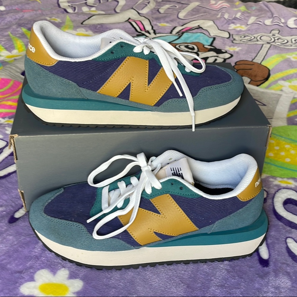 Men’s size 8 New Balance Blue and Gold Sneakers